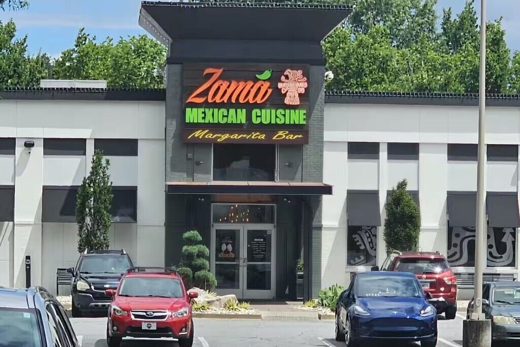 A building with a sign that reads 'Zama Mexican Cuisine Margarita Bar.'