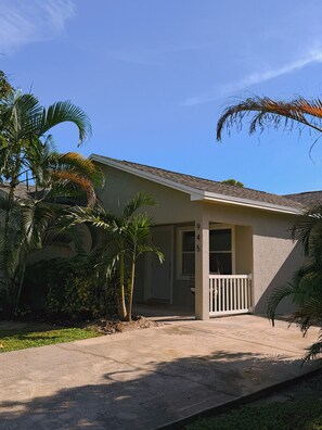 A single-story house with a front porch, a mailbox, and a number '945' on the wall. - The Sailfish (Stuart)