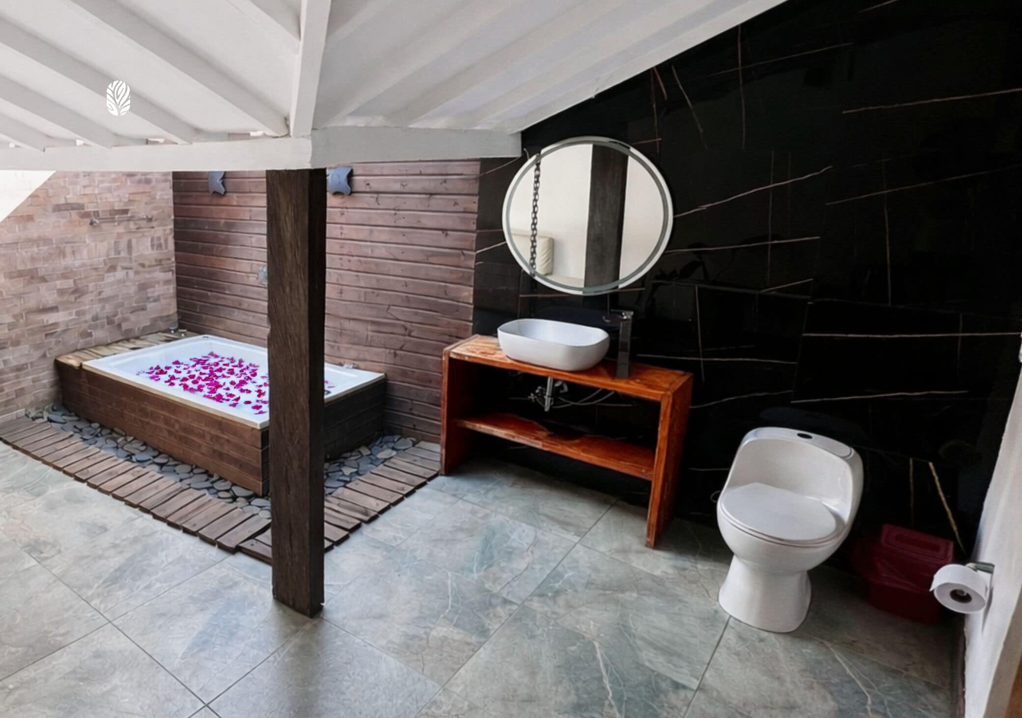A bathroom with a bathtub, a sink, and a toilet.