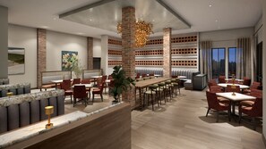 Ein modernes Restaurant mit hohen Decken, Ziegeldetails und verschiedenen Sitzmöglichkeiten, darunter Sitzecken und Tische.
