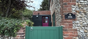 Charming Norfolk brick and flint cottage, with modern, cosy interiors.
