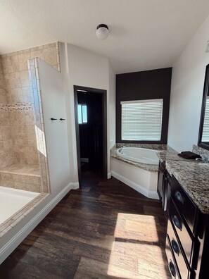 A modern kitchen with a built-in oven, a countertop with a sink, and a window with blinds. - Spacious 4 Bedroom home on an 80 acre horse ranch- 15 minutes from Wine Country (Hemet)