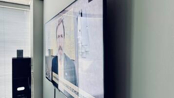 A television screen displaying a news broadcast with a visible 'CHICAGO' label.