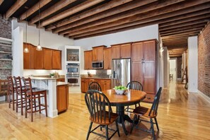 Kitchen | Fully Stocked Kitchen with Island and Bar Seating | Third Floor of Building — Unit on One Level - Stylish CBD Loft , 5 min to French Quarter (New Orleans)