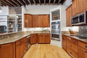 Kitchen | Kitchen with Stainless Steel Appliances and Natural Light | Third Floor of Building — Unit on One Level - Stylish CBD Loft , 5 min to French Quarter (New Orleans)