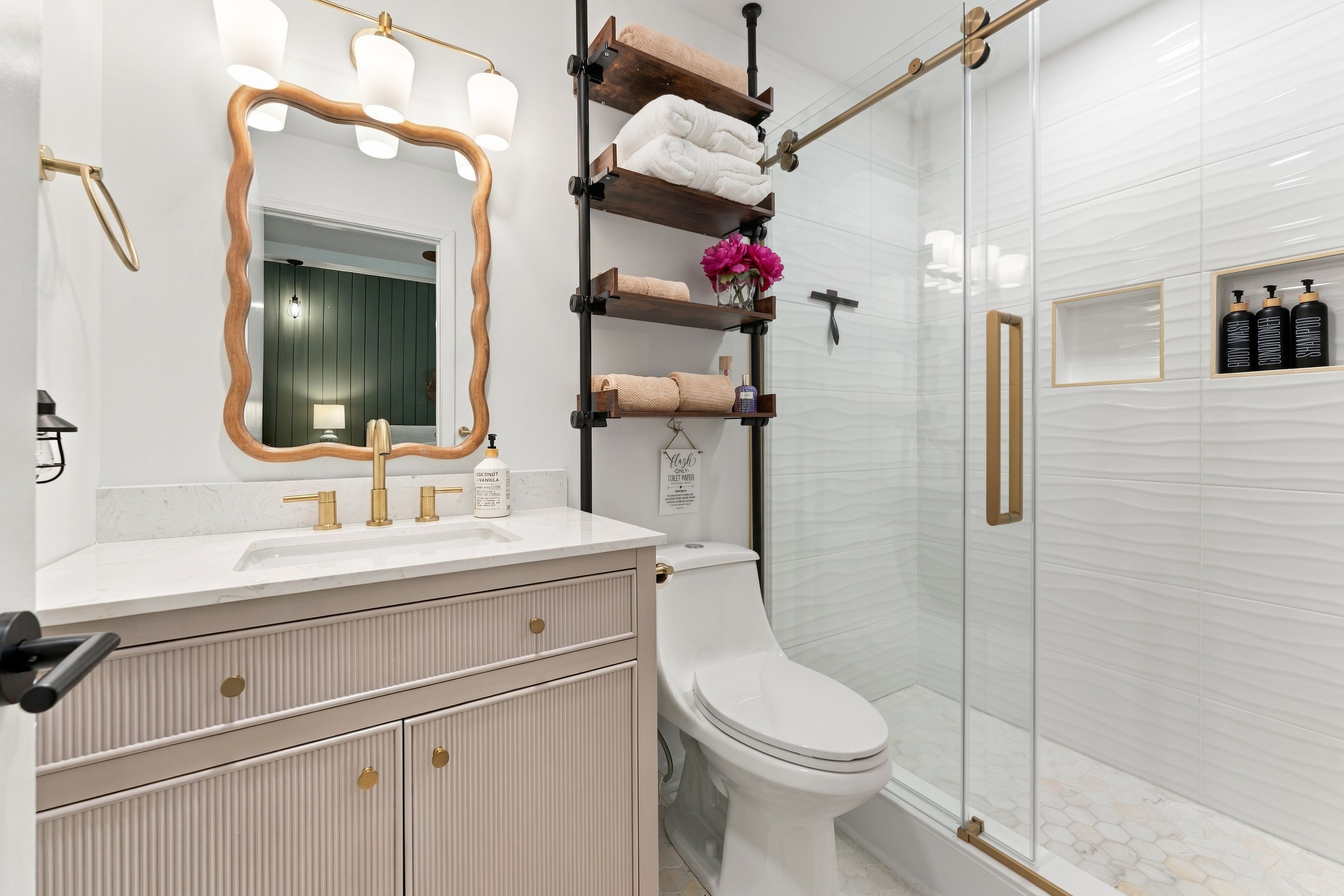 Spa elegance meets French luxury: marble, gold fixtures, and a showstopping shower where every morning feels like a getaway.