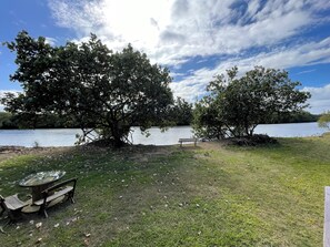 A lakeside park with a bench and picnic table. - River frontage on Maroochy River, Sunshine Coast! (Maroochy River)