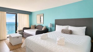 A hotel room with two beds, a view of the sea, a balcony, and a large window. - Endless Ocean Views | 15th Floor King Studio (Myrtle Beach)