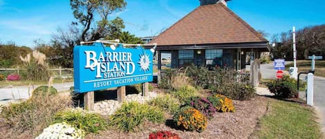 A sign for Barrier Island Resort & Vacation Village.
