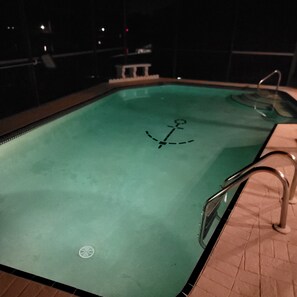 A swimming pool with a ladder on the right side and a drain in the center. - Waterfront 3 BR / 3 bath home w/ heated pool in Punta Gorda Isles. Sleeps 8. (Punta Gorda)