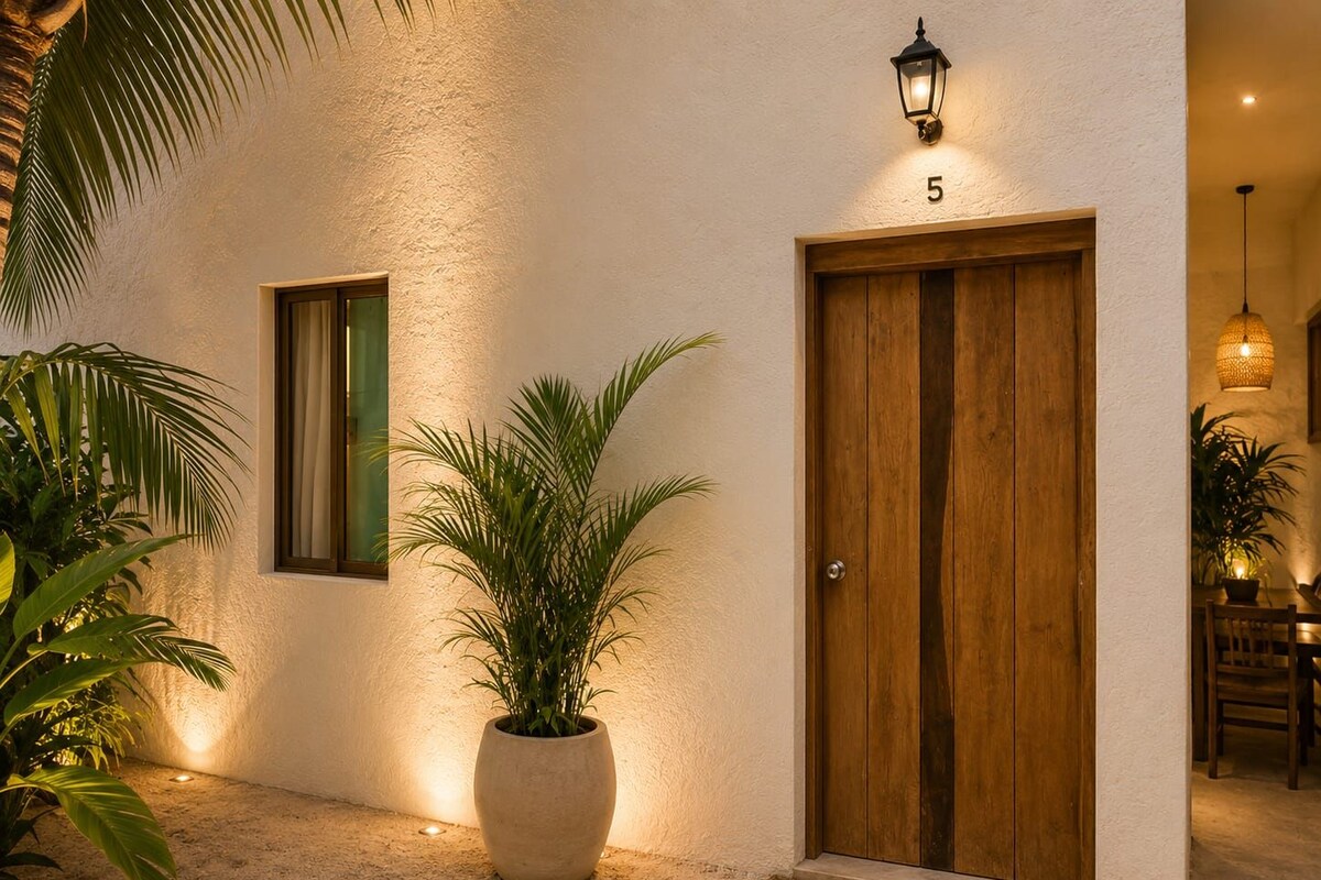 A building entrance with a wooden double door, a potted plant, a wall-mounted light fixture, and a number '5' sign.