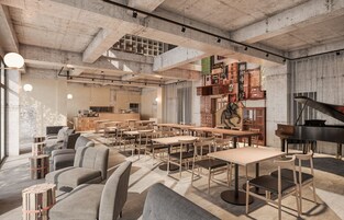 Un café amplio con techos altos, concreto a la vista y diferentes opciones de asientos, incluyendo mesas y sofás.