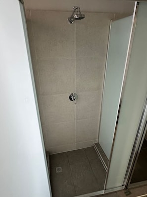 A small, enclosed shower area with a glass door and a showerhead. - 5 mins to Central Sydney
Lord Raglan Hotel (Alexandria)