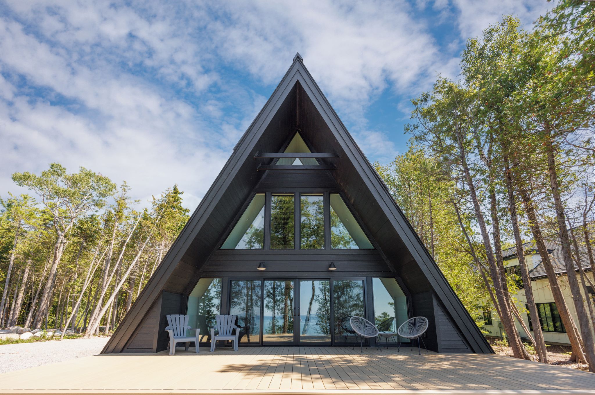 Modern A-frame retreat with expansive deck and forest views
