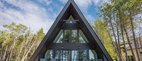 Modern A-frame retreat with expansive deck and forest views