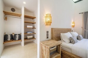 A bedroom with a wooden headboard, bedside lamps, and a nightstand. - Cozy 2BR in Ubud w Rice Field&Temple Views+Pool (Kecamatan Ubud)