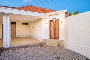 A building with a tiled roof, a white exterior, and a wooden door labeled 'LAPALMA'. - Brand New Paradise 2BDR Villa, Large Pool, Canggu (Kabupaten Badung)