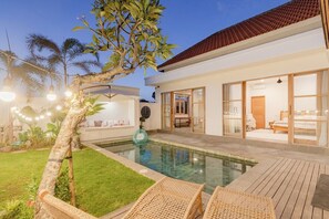 A modern house with a swimming pool, outdoor furniture, and a well-maintained garden. - Brand New 3 BDR Villa+Ricefield Views+Beach Access (Mengwi)