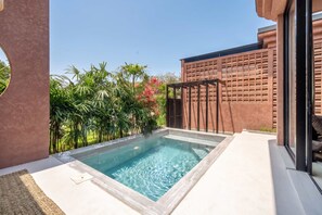 A swimming pool with a pergola and a wooden fence, surrounded by lush greenery. - PROMO -20%OFF New 1BR Villa with Pool for Couples (Kabupaten Badung)