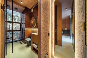 A modern bathroom with a large window, a wooden vanity, and a towel rack. - Tropical 1BR Hideaway in Ungasan w Pool & Patio (South Kuta)