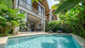 A modern house with a swimming pool surrounded by lush greenery. - Cozy 1BR in Ubud's Heart w Large Pool+Jungle View3 (Tampaksiring)