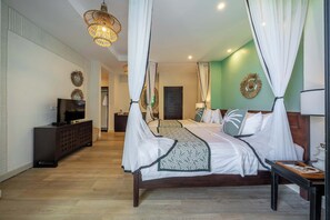A bedroom with a four-poster bed, a television on a cabinet, and a large window with curtains. - Serene Room in Mesari Hotel Ubud w Rice Field View (Gianyar Regency)