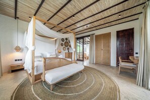A spacious bedroom with a four-poster bed, a large window, and a view of the outdoors. - Putri Salju - Tropical 2BR Villa w Huge Garden+Patio • Lush Ubud (Kabupaten Gianyar)