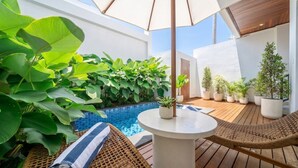 A rooftop terrace with a pool, wicker furniture, and potted plants. - Designer 3BR Villa by Sanur Beach • Pool & Rooftop (Denpasar Selatan)