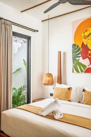 A hotel room with a bed, a window with curtains, a ceiling fan, a pendant light, and a painting on the wall. - Tropical 2BR Gem in Ubud w Private Pool & Gazebo (Gianyar Regency)