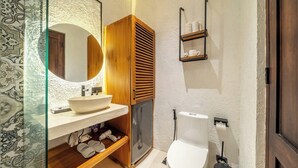 A bathroom with a wooden vanity, a sink, a toilet, and a mirror. - Best 1BR Stay in Ubud • Pool • Garden • Kitchen (Gianyar Regency)