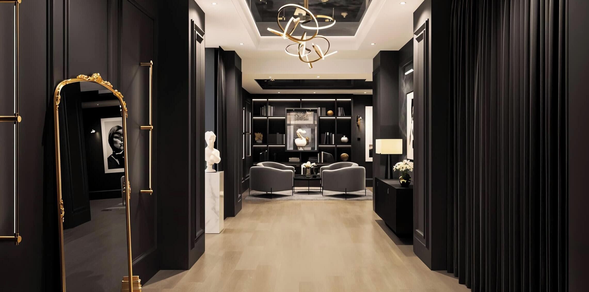 A modern interior with a dark color scheme, a chandelier, and a seating area with two chairs.