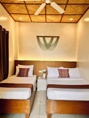 A hotel room with two beds, a wooden headboard, a ceiling fan, and a woven ceiling design. - Panari Lodge El Nido  (El Nido)
