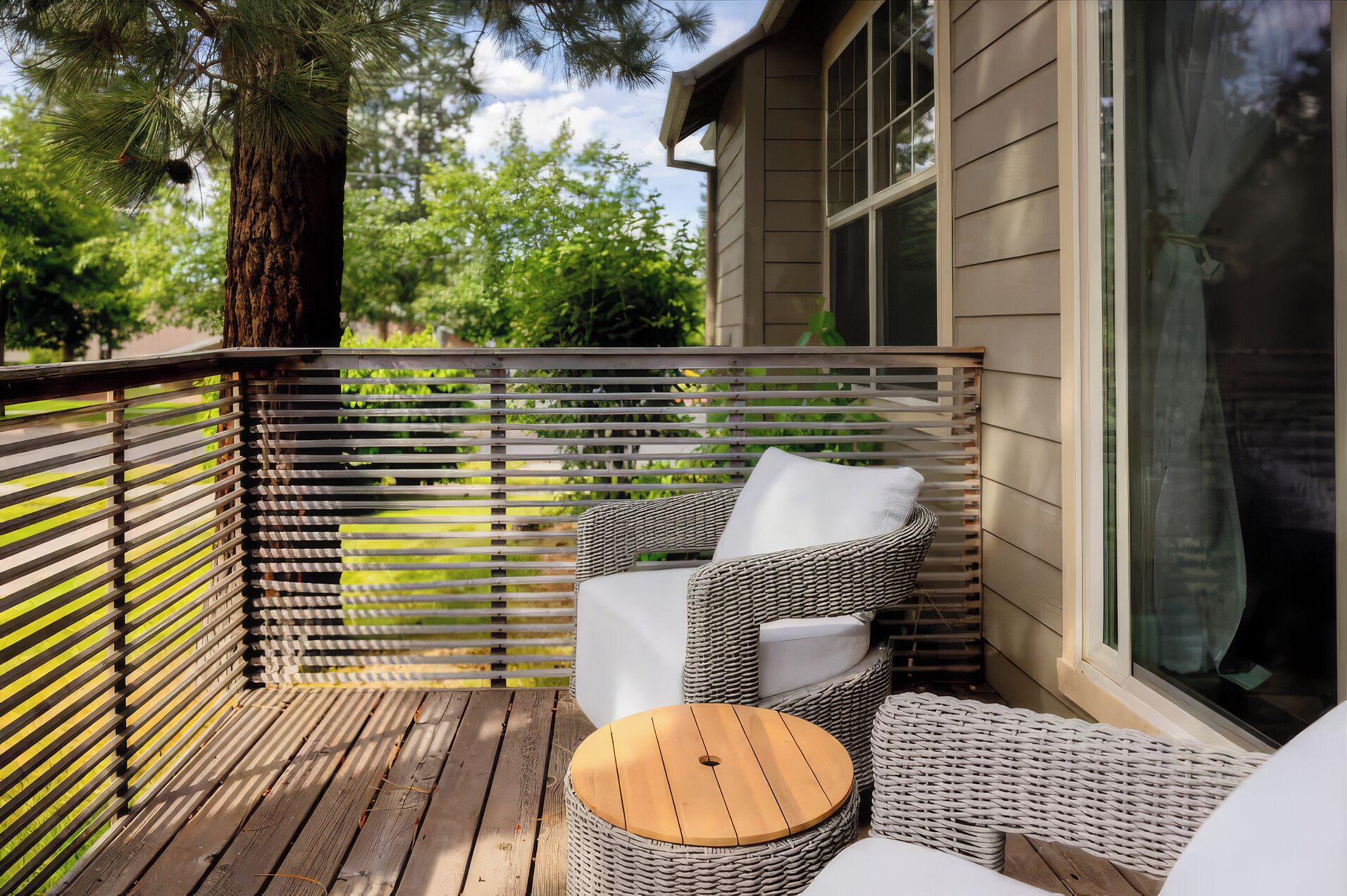 A tucked-away balcony offers cushioned seating and a leafy setting for quiet mornings or evening downtime.