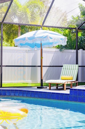 Make the most of the outdoors with a private pool, BBQ grill, and cozy seating area designed for swimming, dining, and unwinding with family or friends.