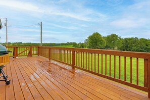 A wooden deck with a metal grill and a view of a green field. - Game Room & Countryside Views! Salvisa Family Gem (Salvisa)