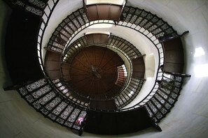 A spiral staircase with ornate railings and a central column. - The good life in Karoline's house (Binz)