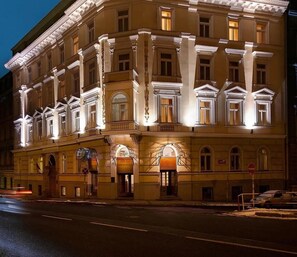 A historic building with classical architecture, featuring multiple windows and ornate detailing. - Kinsky Fountain (Hlavní město Praha)