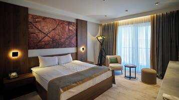 Deluxe Double Room, Balcony | In-room safe, blackout drapes, soundproofing, iron/ironing board