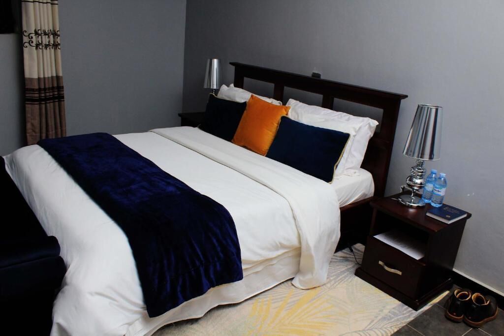 Family Room, Balcony, Garden View | Desk, blackout drapes, iron/ironing board (on request), WiFi (free)