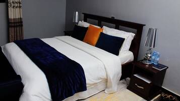 Family Room, Balcony, Garden View | Desk, blackout drapes, iron/ironing board (on request), WiFi (free)