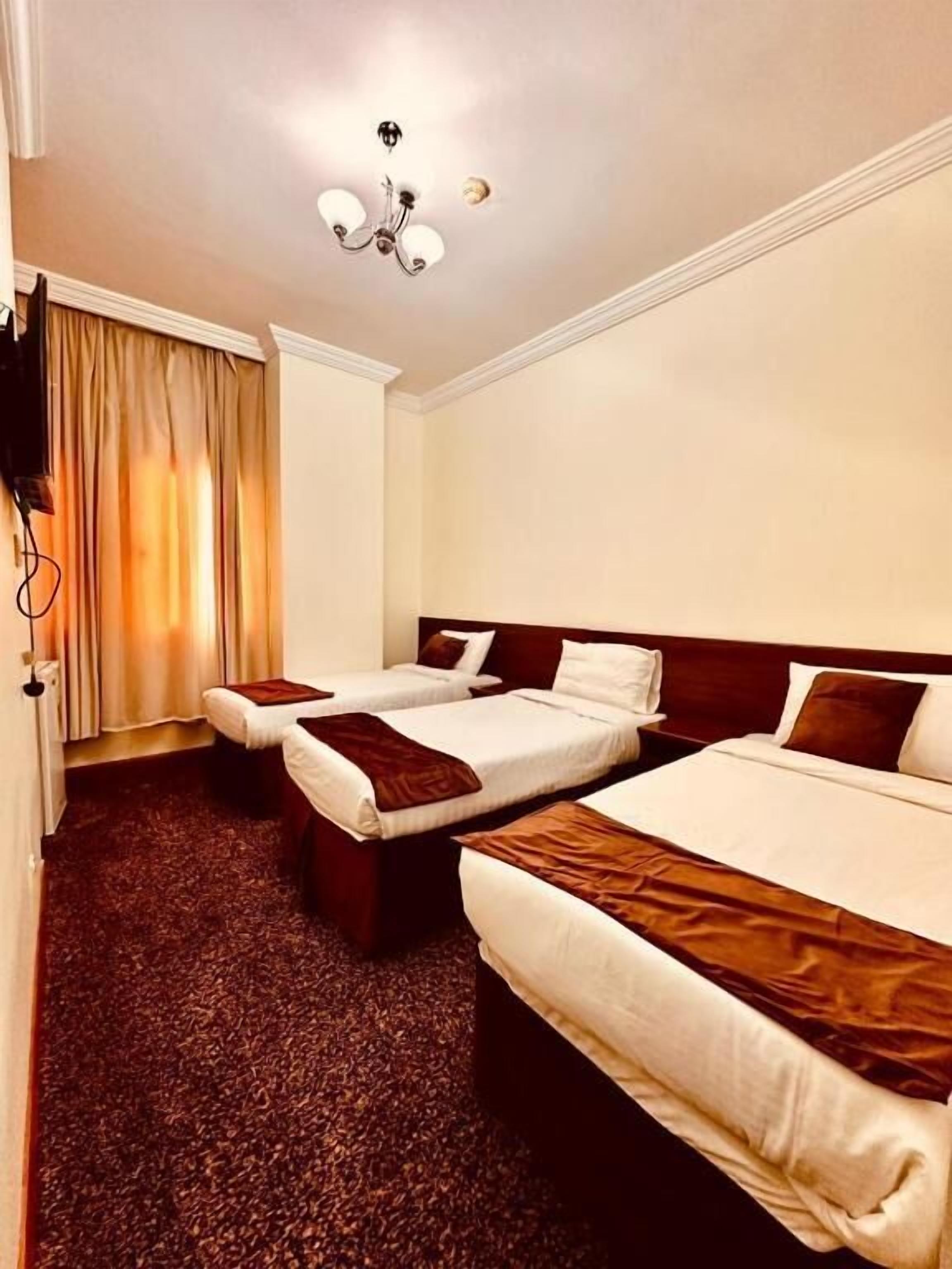 Quarto triplo, vista para a cidade | Wi-Fi de cortesia