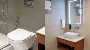 A modern bathroom with a toilet, shower, and sink. - Kashi Courtyard (Varanasi)