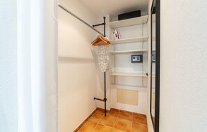 A narrow hallway with a clothes drying rack, a security keypad, and a shelf unit. - Awesome apartment in Arta with WiFi (Arta)