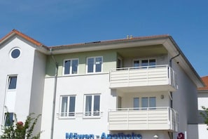 A two-story building with a balcony on the upper floor, labeled 'Möwen Apotheke.' - Baltic Sea view - beach only 190m (Karlshagen)