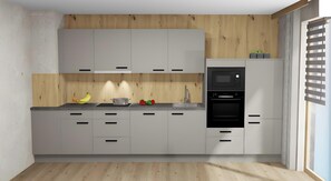 A modern kitchen with white cabinets, a built-in oven, and a microwave. - Apartment "Filzenkogel" with Mountain View, Private Garden and Wi-Fi (Hippach-Schwendberg)