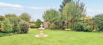 Self contained log cabin with lots of greenery