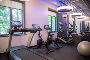 A gym with treadmills, stationary bikes, and exercise balls. - Downtown Views | Pet-friendly & In-Room Dining (Portland)