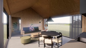 A modern interior with a wooden ceiling, a sofa, a dining table, and a view of the outdoors. - Þjórsárdalur Lodges & Cabins (Skeiða- og Gnúpverjahreppur)