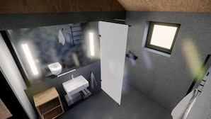 A modern bathroom with a toilet, sink, and mirror. - Þjórsárdalur Lodges & Cabins (Skeiða- og Gnúpverjahreppur)