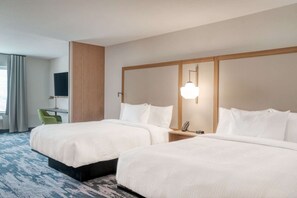 A hotel room with two beds, a desk, a chair, a TV, and a lamp. - Minutes to KFC Yum! Center + Free Breakfast & Gym (Shelbyville)
